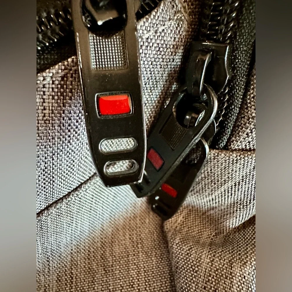 Backpack Excellent condition! Lots of zip compartments. Grey black. Clean!